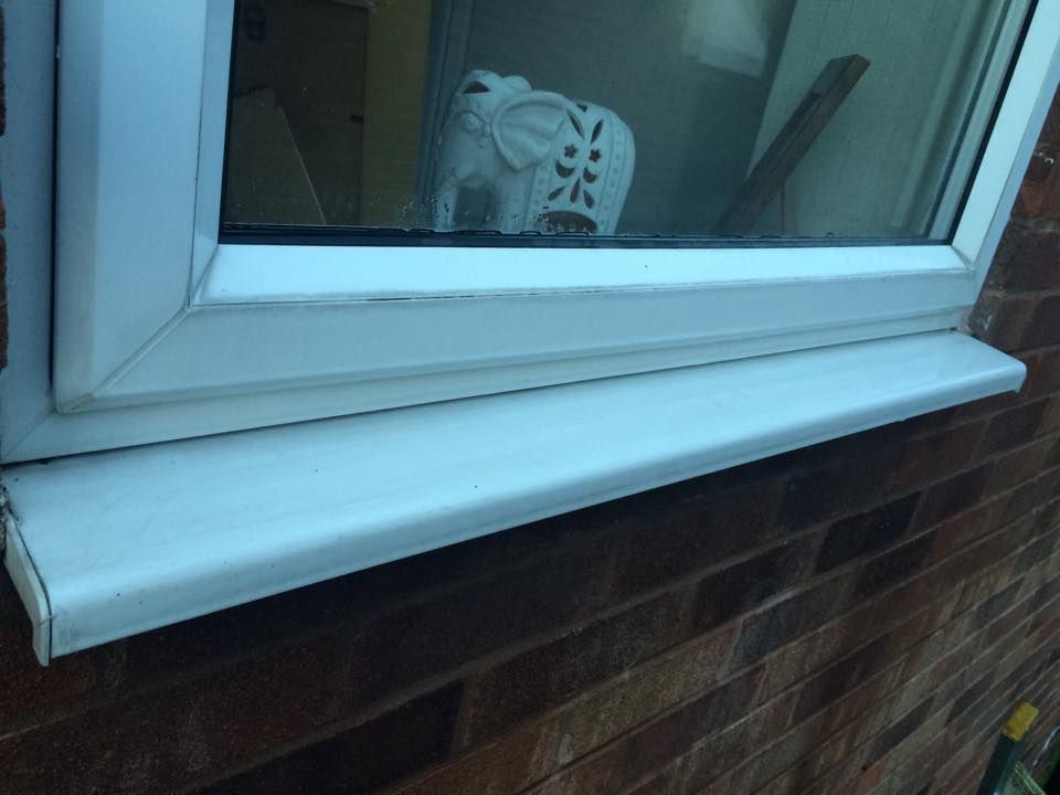 The same window sill cleaned back to bright white after Ryan's Window Cleaning