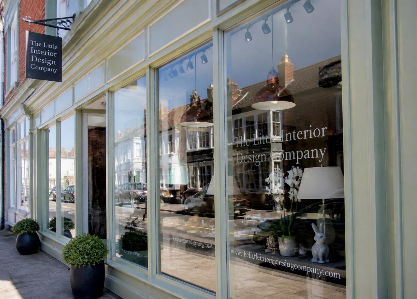 Clean shop front windows on a British high street after commercial window cleaning